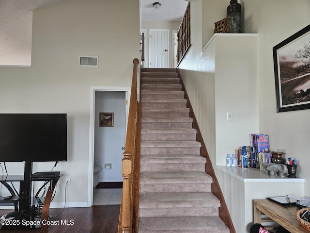 813 Pine Shadows Ave, Rockledge, FL 32955 - stairs with visible vents and wood finished floors
