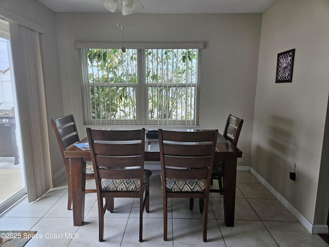 813 Pine Shadows Ave, Rockledge, FL 32955 - tiled dining space featuring baseboards and ceiling fan