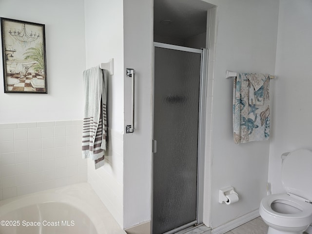 813 Pine Shadows Ave, Rockledge, FL 32955 - bathroom with a stall shower, toilet, and a garden tub
