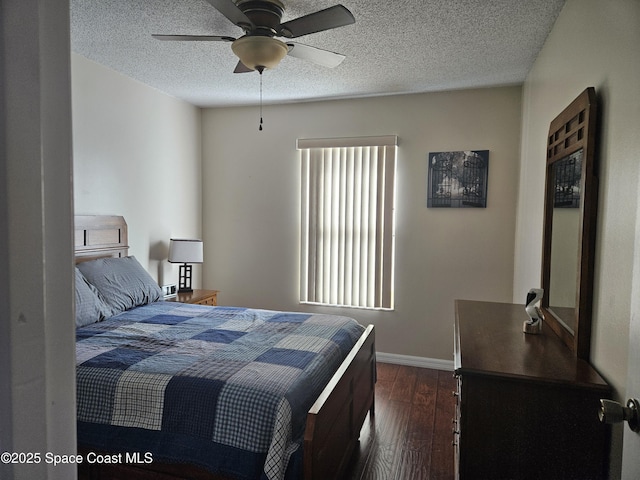 813 Pine Shadows Ave, Rockledge, FL 32955 - bedroom with baseboards, a ceiling fan, dark wood finished floors, and a textured ceiling