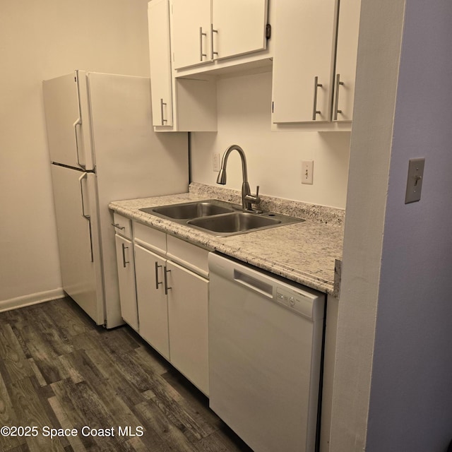 kitchen featuring white dishwasher, dark hardwood / wood-style flooring, sink, and white cabinets