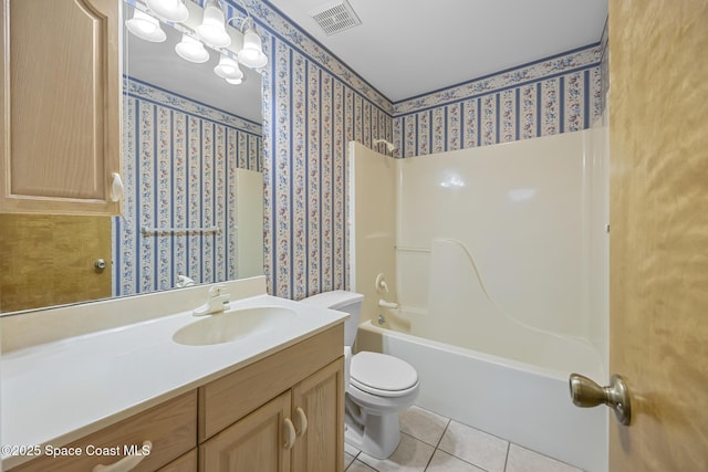 full bathroom featuring tile patterned flooring, vanity, a notable chandelier, toilet, and washtub / shower combination