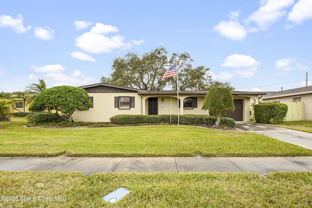 ranch-style house featuring a garage and a front yard