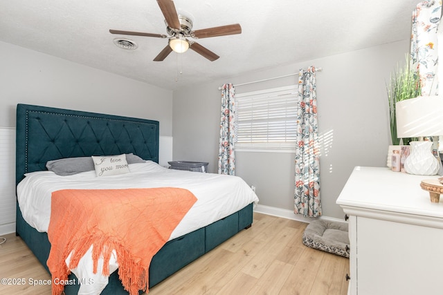 bedroom with hardwood / wood-style floors and ceiling fan