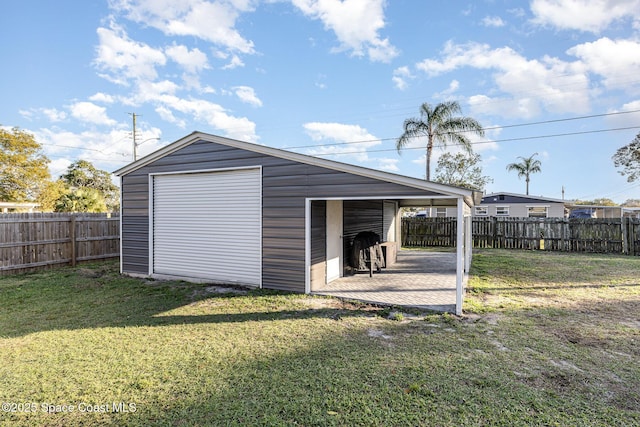 garage with a yard