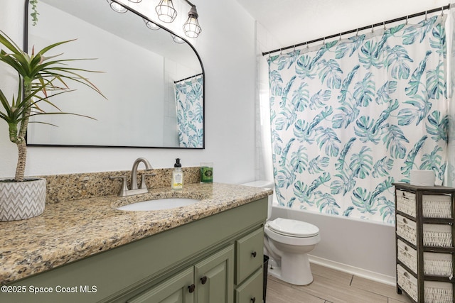 full bathroom featuring shower / tub combo, vanity, and toilet