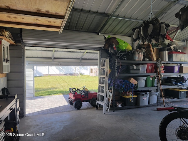 garage with a lawn