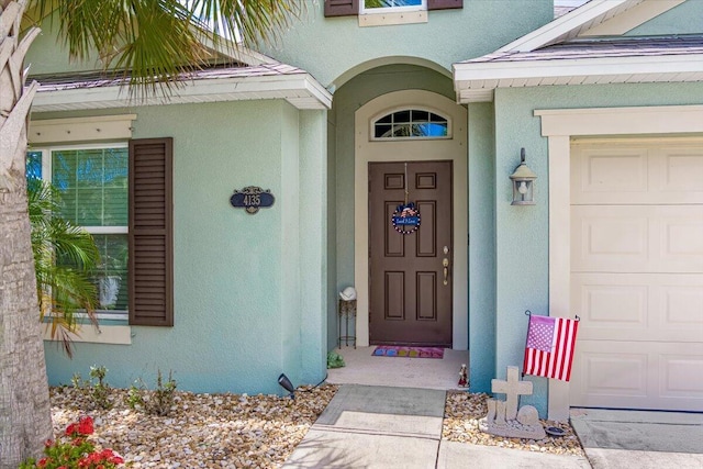 doorway to property featuring a garage