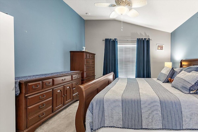 carpeted bedroom with lofted ceiling and ceiling fan