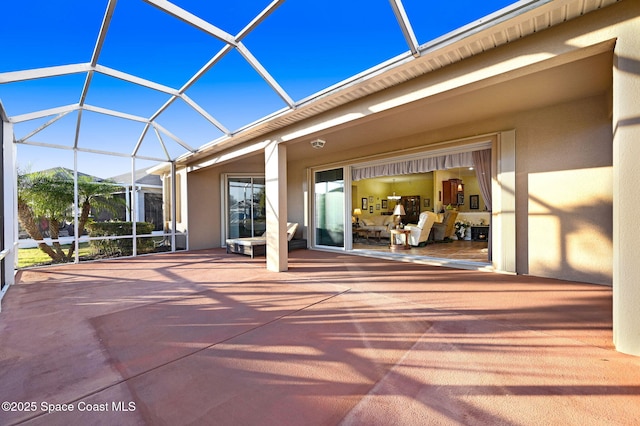 view of patio with a lanai