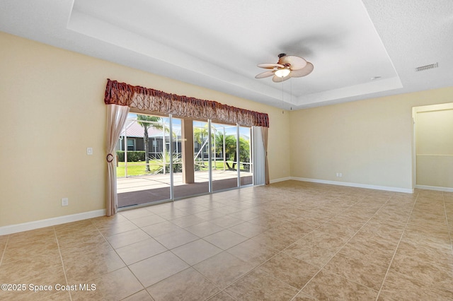 3804 Sansome Cir, Melbourne, FL 32940 - spare room with a raised ceiling, visible vents, a ceiling fan, and light tile patterned floors