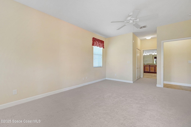 3804 Sansome Cir, Melbourne, FL 32940 - empty room featuring light colored carpet, baseboards, and a ceiling fan