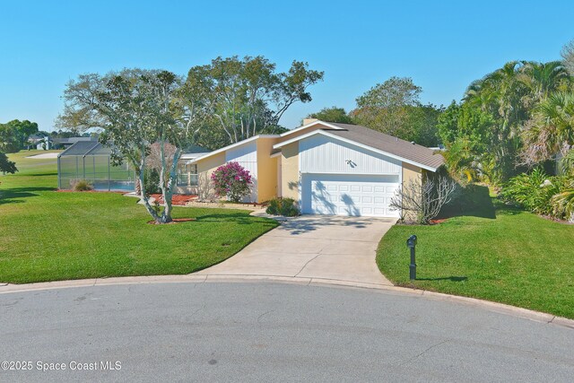 view of front facade with a garage, concrete driveway, glass enclosure, and a front lawn