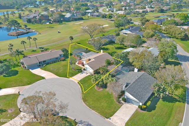 drone / aerial view with a water view and a residential view