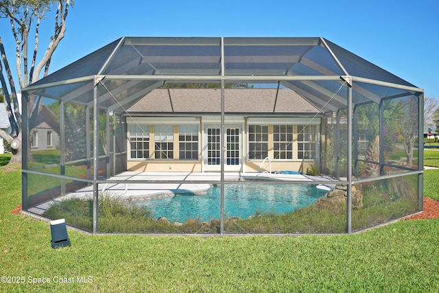 pool featuring a patio area and a lawn