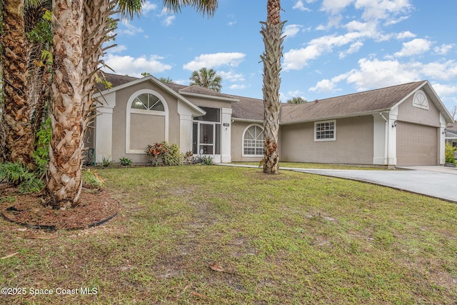 single story home with a garage and a front yard