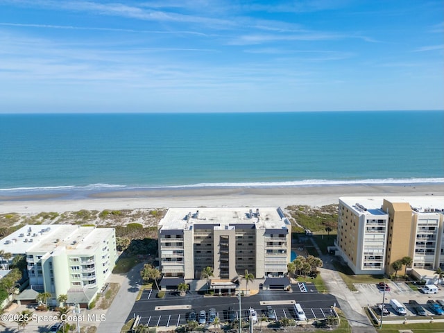 bird's eye view featuring a water view and a view of the beach