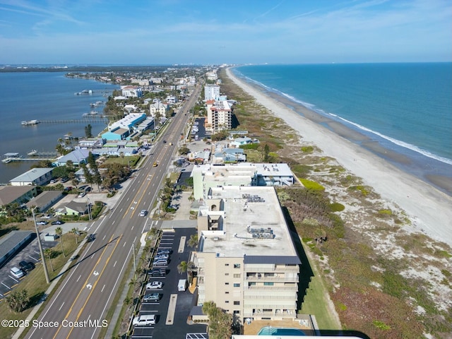 aerial view featuring a view of the beach and a water view