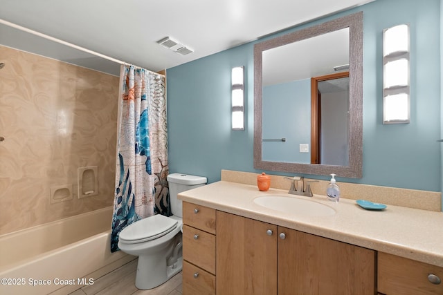 full bathroom with vanity, shower / bath combination with curtain, and toilet