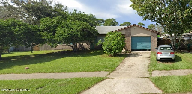 view of front of property featuring a garage and a front yard