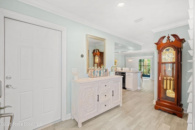 hallway with crown molding and light hardwood / wood-style floors