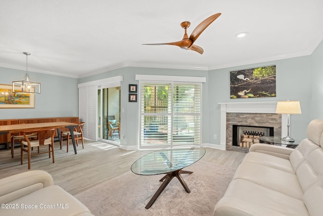 living room with ornamental molding and light wood-type flooring