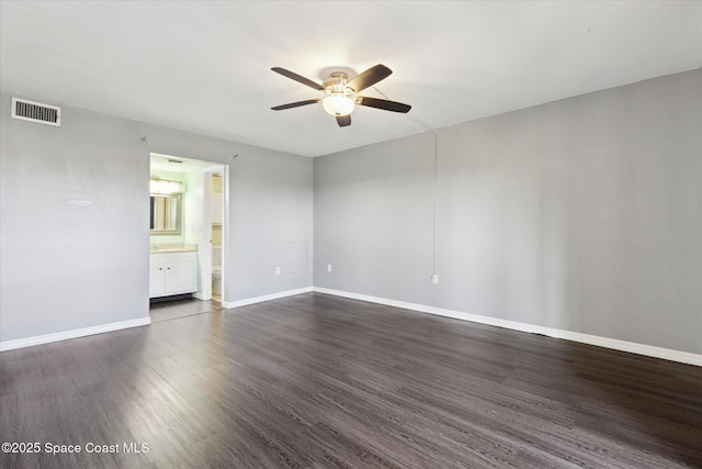 interior space with dark wood finished floors, visible vents, baseboards, and ceiling fan