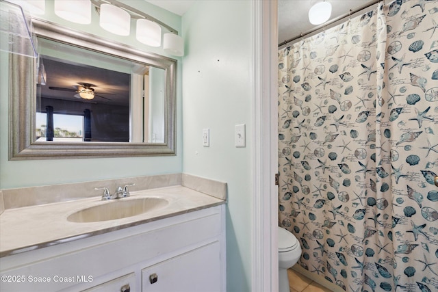 bathroom with a shower with shower curtain, toilet, vanity, and tile patterned flooring