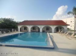 view of swimming pool featuring an outbuilding