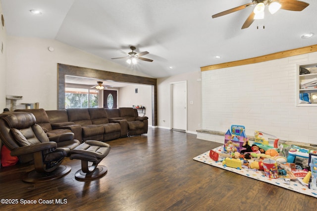 living area with baseboards, vaulted ceiling, and dark wood finished floors