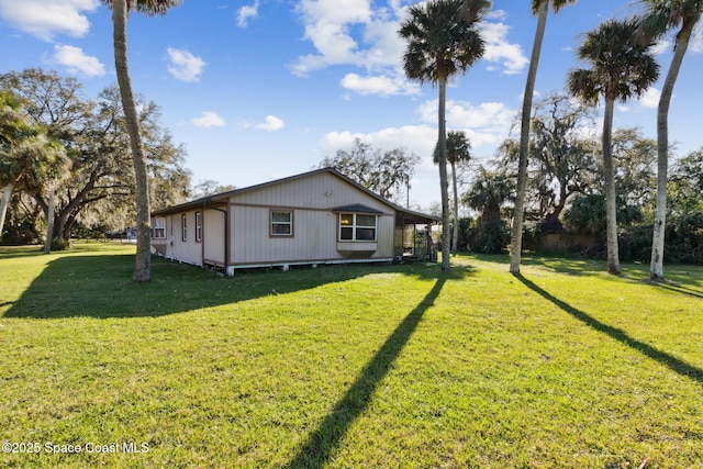 view of home's exterior with a lawn