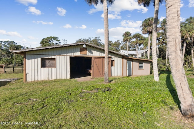 exterior space with an outbuilding and driveway