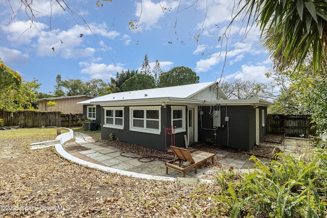 back of property featuring central AC unit