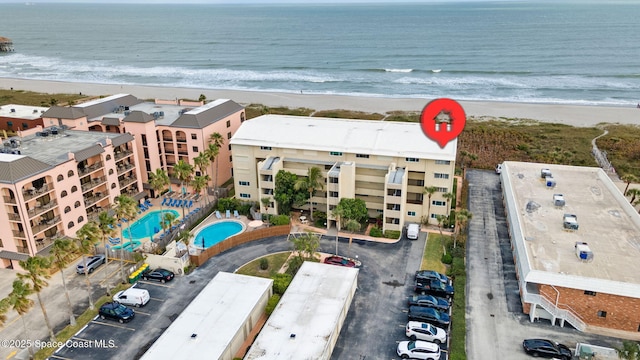 bird's eye view with a water view and a view of the beach