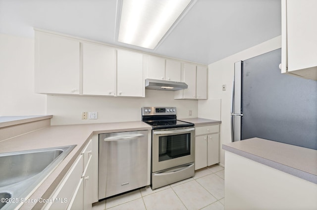 kitchen featuring white cabinetry, appliances with stainless steel finishes, sink, and light tile patterned flooring