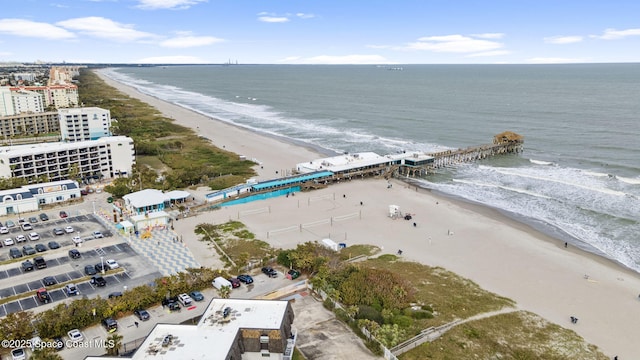 birds eye view of property featuring a water view and a view of the beach