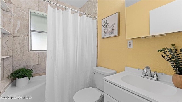 bathroom with vanity, curtained shower, and toilet