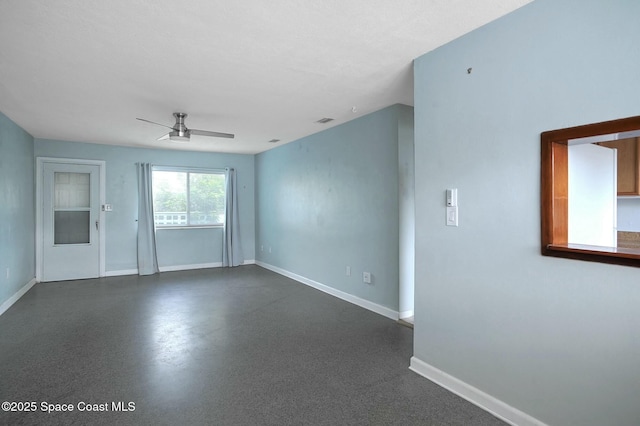 spare room with ceiling fan