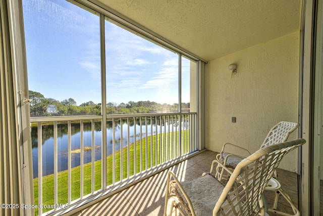 sunroom with a water view