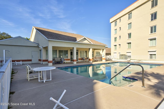 view of pool featuring a patio