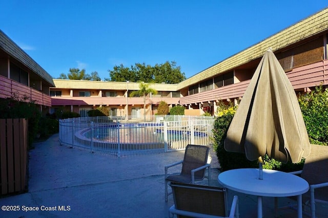 view of patio / terrace featuring a community pool