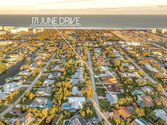 aerial view at dusk with a water view