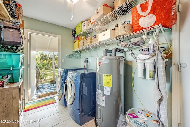 laundry room featuring light tile patterned flooring, ceiling fan, separate washer and dryer, and water heater