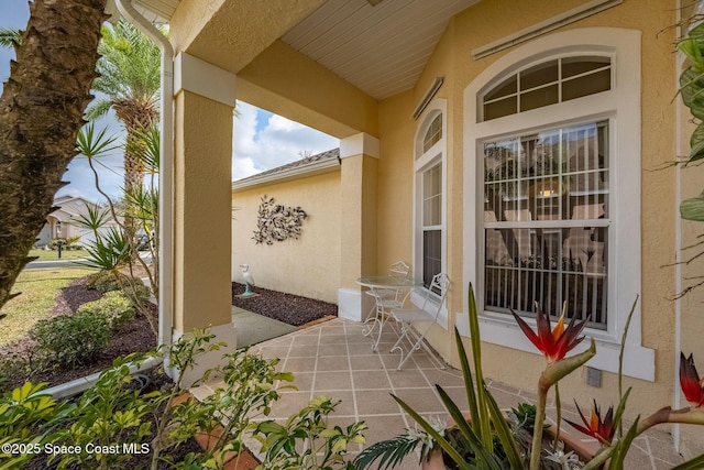 property entrance featuring a patio