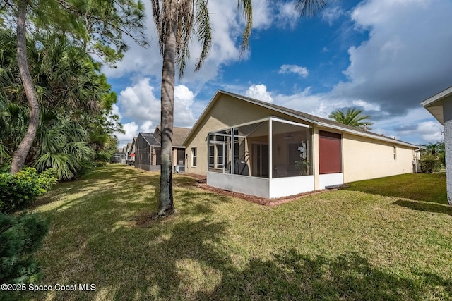 view of side of home featuring a lawn