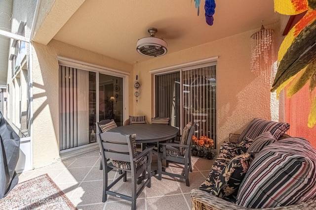 view of patio featuring ceiling fan