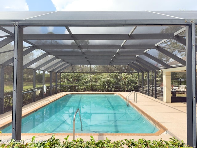 view of pool featuring a lanai and a patio area