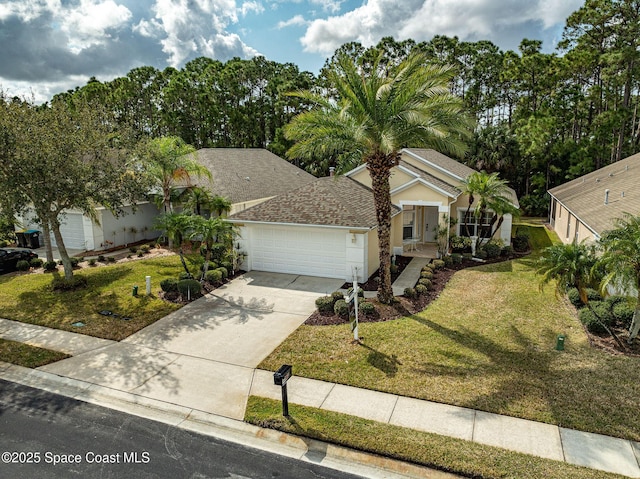 view of front of home featuring a garage and a front yard