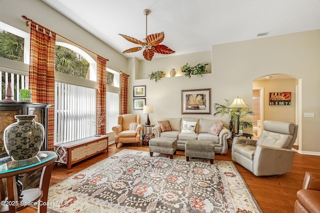 living room with ceiling fan and light hardwood / wood-style floors