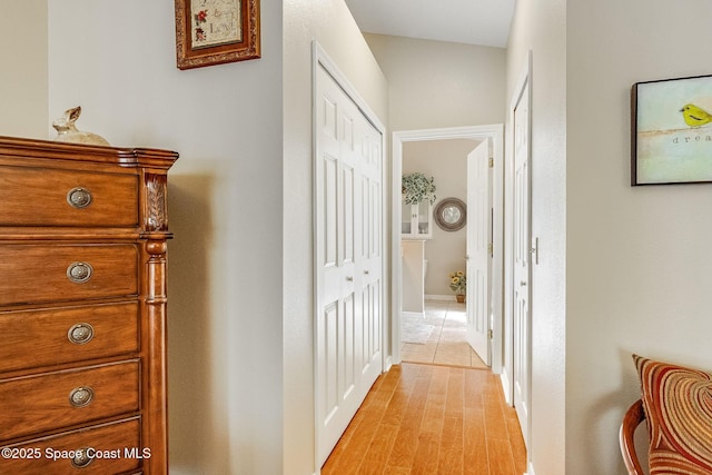 hallway with light hardwood / wood-style flooring